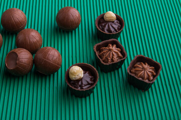 Assortment of various sweet chocolate candies with different fillings.