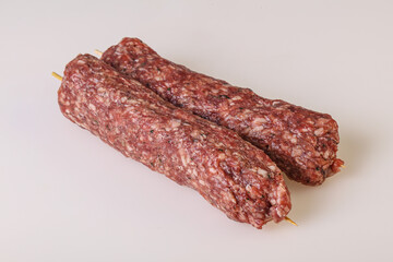 Raw minced beef kebab skewer