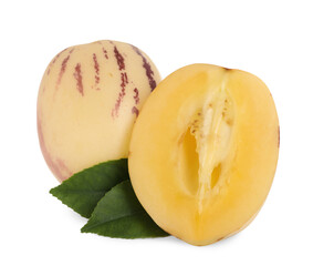 Whole and cut pepino melons with green leaves isolated on white