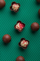 Vertical shot top view assorted brown chocolates.