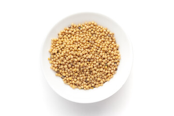 Macro close-up of Organic Mustard seed (Sinapis alba) on white background. Pile of Indian Aromatic Spice. Top view