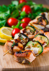 Fish skewers with mixed salad. High quality photo.