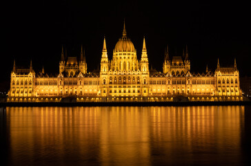 Fototapeta premium landscape with city lights reflected in the lake water