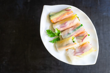 spring rolls Nem vegetables in rice paper organic dish on the table healthy food meal snack copy space food background rustic. top view keto or paleo diet veggie vegan or vegetarian food
