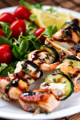 Fish skewers with mixed salad. High quality photo.