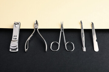 Set of manicure tools on color background