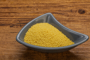 Raw cous cous heap in the bowl