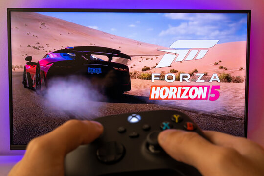 Man playing Forza Horizon 5 with Xbox controller. 14th Jun, 2021, Sao Paulo, Brazil