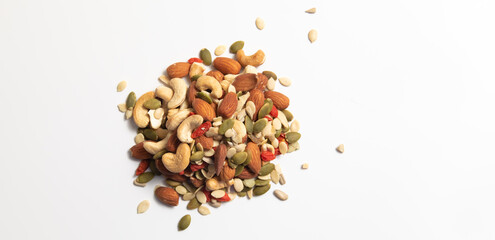 mixed organic cereal and grain seed pile on white background. healthy eating concept. pumpkin, sunflower seeds and legumes.