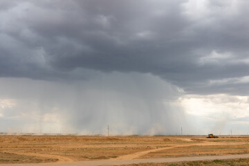 Cumulonimbus storm clouds and heavy rain over Kazakh steppe.