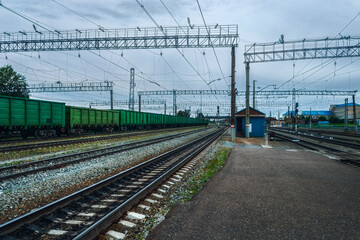 Naklejka premium Railway station with the standing freight cars