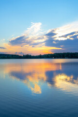 magnificent sunrise on the river bank in summer