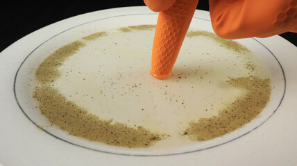 Pepper and soap trick on the plate