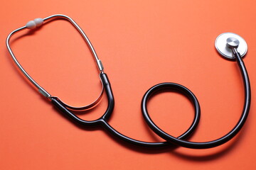 Blue medical stethoscope isolated on blue background