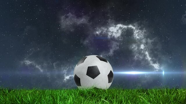 Animation of glowing light passing by football on pitch with stormy clouds