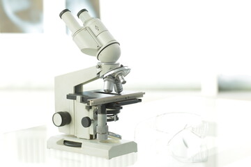 Fototapeta na wymiar Medical microscope stands on a glass table in a medical laboratory
