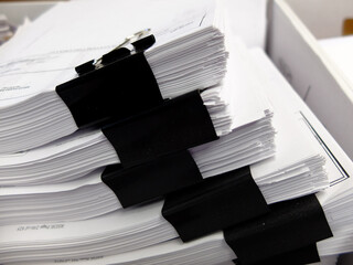 Stacks of Documents with Clips in Box for Filing Business