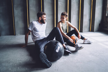 Cheerful athletes resting after workout