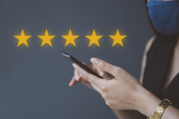Customer Experience Concept, Business women holding the smartphone with Excellent Face and Rating...
