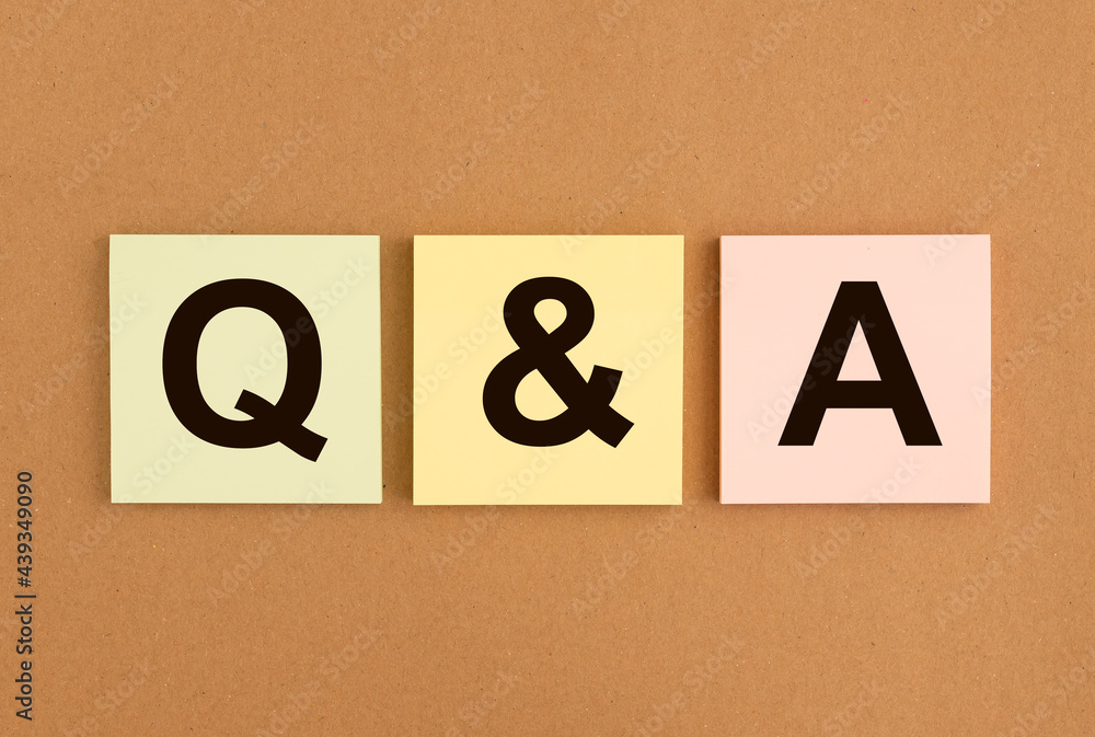 Poster qa acronym on sticky notes on brown board. qna word. q concept. questions and answers.