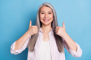 Photo of cheerful woman happy positive smile show thumb-up like fine advert choice isolated over...