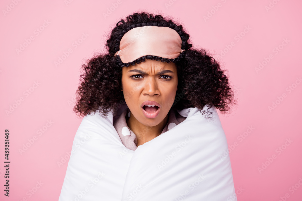 Poster photo of angry shocked wavy dark skin lady dotted sleepwear cover white blanket open mouth isolated 