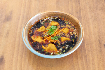 Japanese patty soup, with seaweed, semisa, parsley, chives, shredded carrot