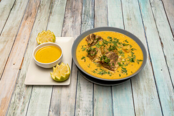 Gray bowl of Ecuadorian green ball broth