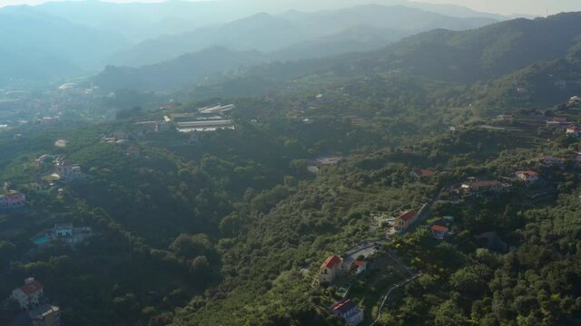 Aerial view of landscape in Garbasso, Celle Ligure comune, Savona province, regione Liguria region. Ligurian coastline with green hills. Drone 4k footage, side panoramic view