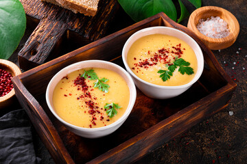 Two bowls of split pea puree soup on the table