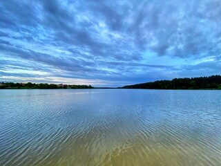clouds over the river. clouds over the lake. lake and sky.