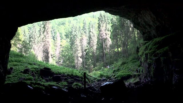 Tourists Exploring Coiba Mare Cave, People Walking in Trip in Mountains, Camping Adventure in Alpine Area Resort, Natural Park 