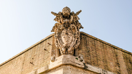 Vatican City. Vatican coat of arms, at the top of one of the Vatican wall corners.