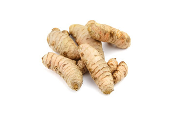 Turmeric spice rhizome isolated on white background. Heap of curcuma longa roots