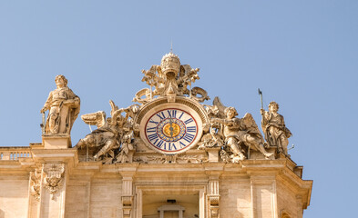 Vatican city. Details of the right exterior clock of St Peter´s Basilica.