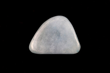 Aquamarine jewel stone texture on black background. Macro closeup.