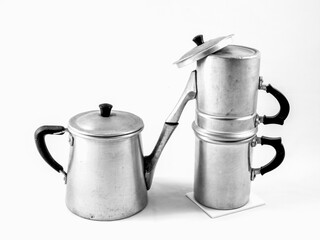 antique aluminum containers for the kitchen: a milk jug and a 