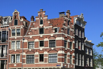 Amsterdam Historic Canal House Facades Against a Blue Sky