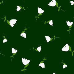Random white simple flowers shapes seamless pattern in doodle style. Green background. Natural ornament.