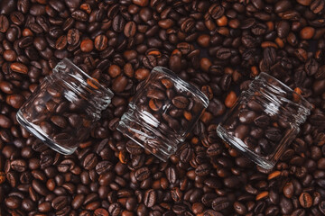 coffee beans close up. Top view. Texture of roasted brown coffee beans.Top view with copy space.