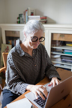 Senior woman working at home office
