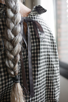 Senior woman with a long braid 