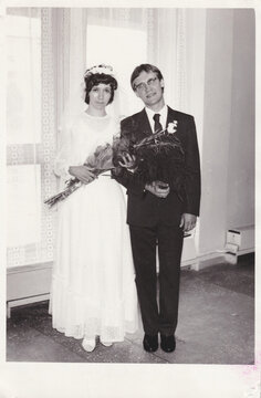 old scanned film photo of wedding couple after ceremony, 1984