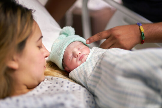 Hospital Healthcare: Delivering baby in hospital: Mom with her newborn in a hospital