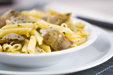 Pasta with Artichokes, Cheese and Herbs. High quality photo.