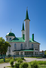 Dome towers are the minaret of a Muslim mosque for performing prayers and rituals of Muslims. Green roofs and white walls, at the top of the crescent moon as a symbol of Islam