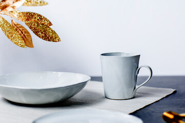 Obraz na płótnie Canvas Stylish dish plate set with cup on table