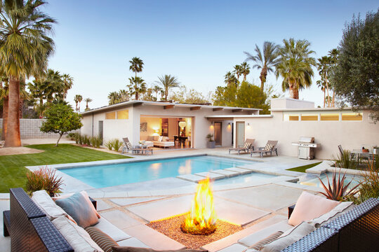 Backyard Fire Pit And Pool At Dusk