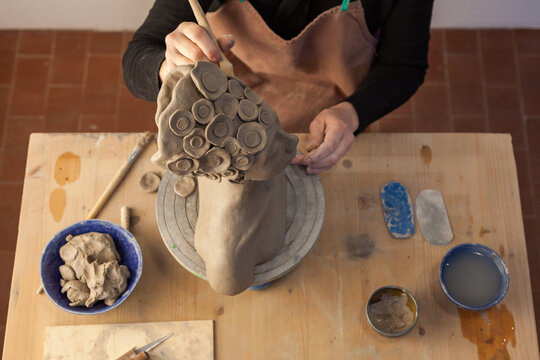 pottery artist modelling clay