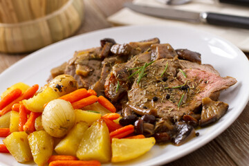 Roast Beef with Potatoes and Carrots. High quality photo.